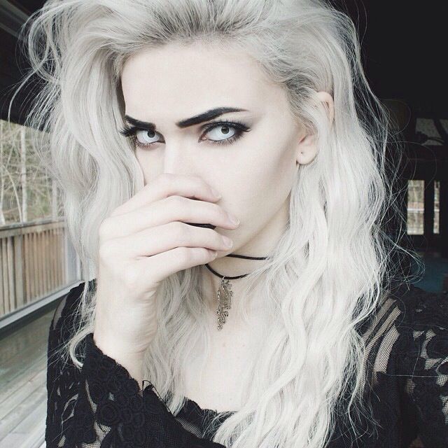 White blonde hair dark eyebrows