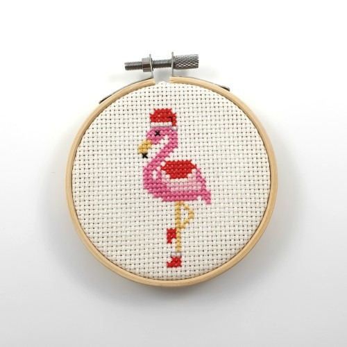 The finished version of this cute flamingo in a Christmas outfitYou can find the pattern here