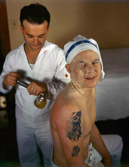 Sailor being treated for burns received during the attack on Pearl Harbor, December 1941. Photo by J