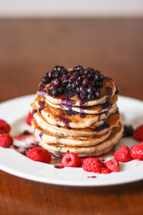 floweringfreedom:  My breakfast this morning was a scrumptious gift from the pancake gods. Whole wheat banana pancakes with warmed blueberries, raspberries, and a bit of pure maple syrup.  