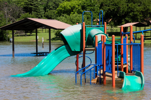 Flooding turned the playground into a water park.