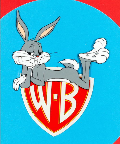 animationproclamations:Bugs hops a ride on the Warner Bros. Shield in The Bugs Bunny Road Runner Mov