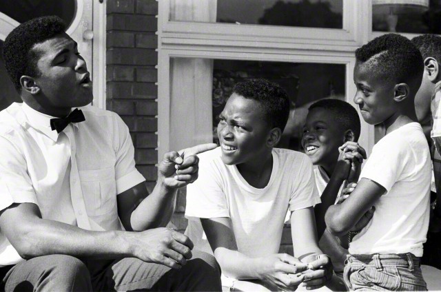 lostinurbanism:  Muhammad Ali with neighborhood kids outside of his mother’s home