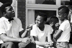 lostinurbanism:  Muhammad Ali with neighborhood kids outside of his mother’s home in Louisville, Kentucky. Steve Schapiro (1963)