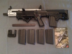 gunrunnerhell:  Kel-Tec RFBA bullpup rifle chambered in 7.62x51mm, this example has an interesting accessory. The owner made a custom pictainny top rail and barrel shroud. It’s different from any of the aftermarket ones you find for the RFB in that