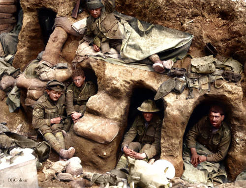 Men of the 8th Battalion, Border Regiment, resting in shallow dugouts in a captured German trench to