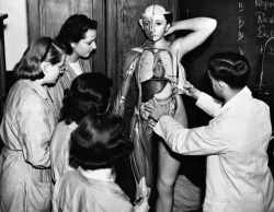 Gerry Cranham - Trainee Nurses Examine A Model Of A Human Body To Learn Anatomy,