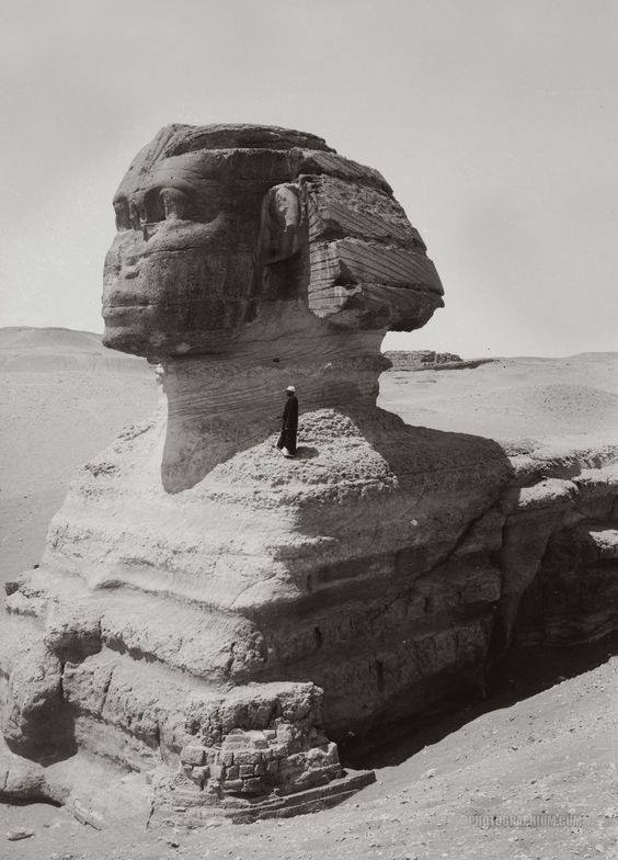 totenbuch:    A man standing on the Sphinx, demonstrating its size; 1900′s, in
