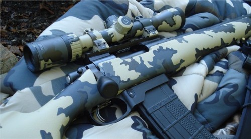 gunrunnerhell: Remington 700 Custom built 700 by Breakneck Creek Precision Rifle Co (BNCP). This is chambered in .458 SOCOM, hence the AR-15 magazine adapter. Generally .458 SOCOM is a heavy hard hitting but short range caliber for the AR platform, a