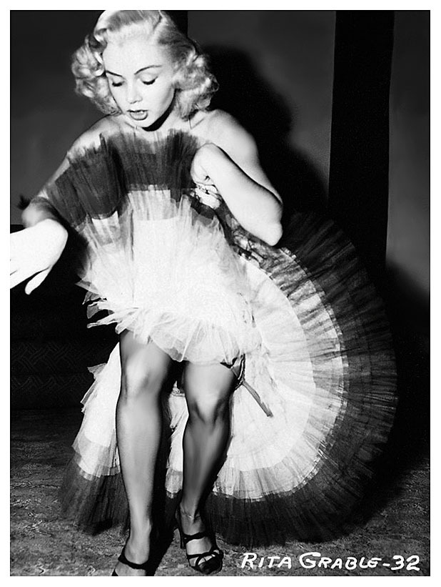   Rita Grable shows off her lovely legs! From a 50’s-era photo series shot by Irving