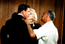 infinitemarilynmonroe:  Marilyn Monroe and Yves Montand receiving direction from George Cukor on the set of Let’s Make Love.