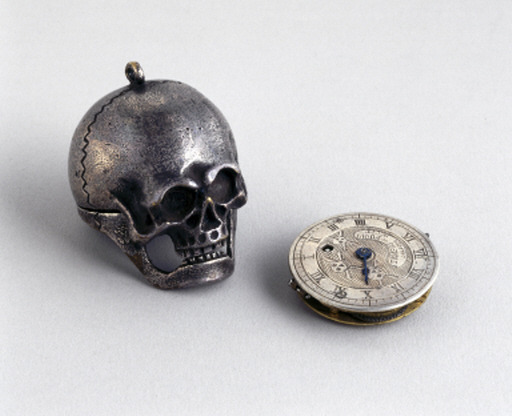 sixpenceee:  Pocket watch concealed in a memento mori, 1700-1936. The engraved Latin