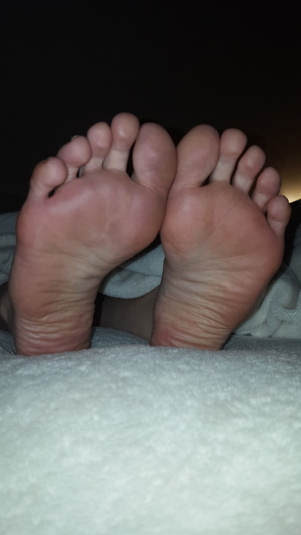 myprettywifesfeet: my pretty wifes cute candid soles laying in bed.please comment