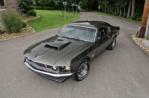 moshrru:      Classic Cars magazine       Today is German-American day in the USA, and to celebrate here’s something suitably American. This Ford Mustang Boss 429 Fastback may lack some of the subtlety of German makes but you’d be invited not to