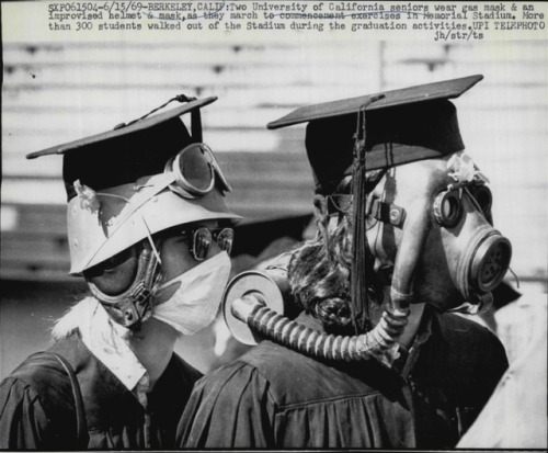 spaceintruderdetector:1969 -   Berkeley, Calif: Two University of California seniors wear gas mask & an improvised helmet & mask  