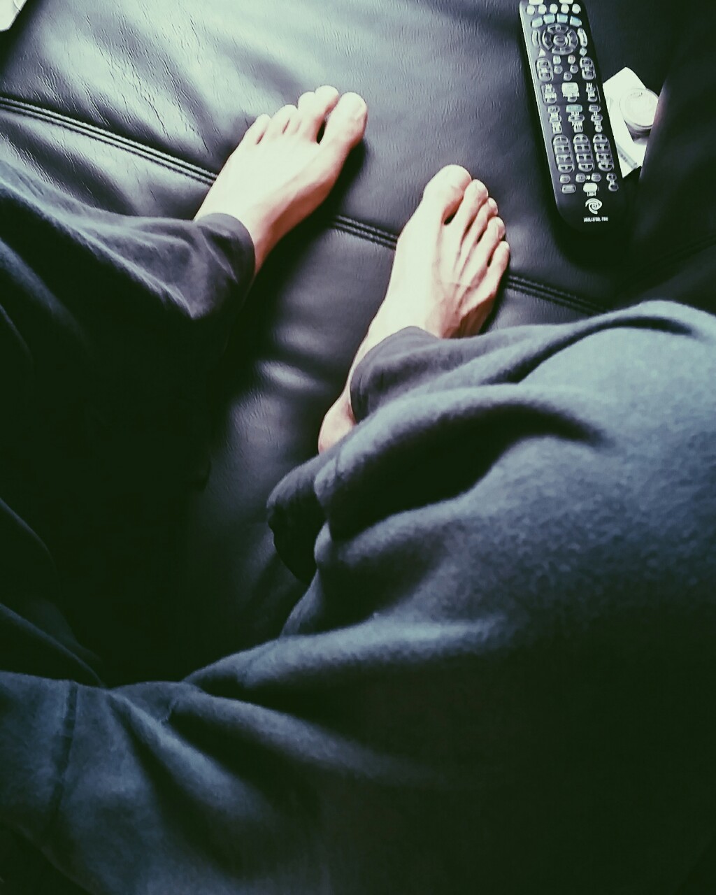 bearinboots75:  myfeetlife:  My feet are just a tad larger than the remote! I have