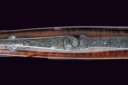 peashooter85:  A rare Dreyse pinfire double rifle originating from Germany, mid 19th century.  Beautifully & ornately engraved scroll work. -fms