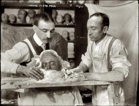 Two men making a death mask, New York, c. 1908Bain News Service