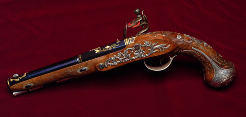 Ornate contemporary made flintlock pistol crafted by J.W. Huddleston of JWH Engraving.http://www.jwh