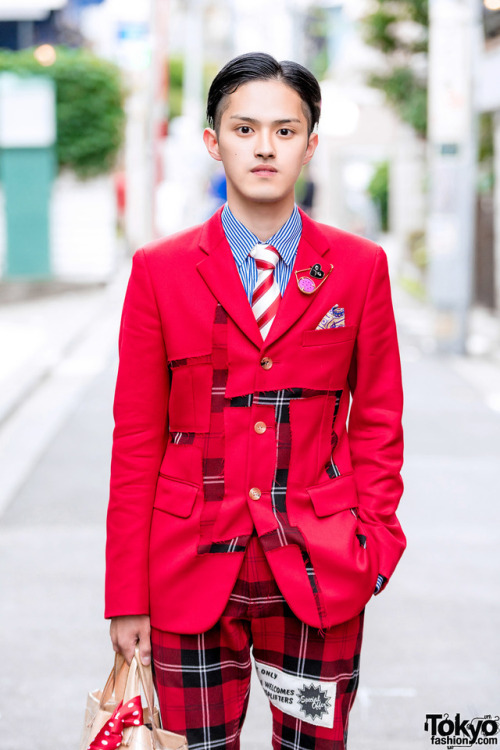 Yoshiaki and Satoko on the street in Harajuku wearing red and black styles by the legendary Japanese