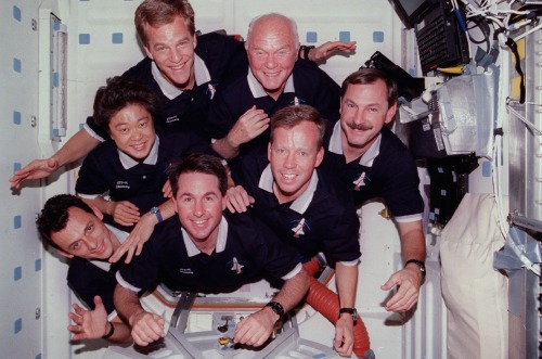 The crew of STS-95, including John Glenn (top centre), onboard Space Shuttle Discovery.  Glenn 