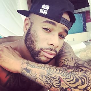 dominicanblackboy:  Sexy tatted hotboy Ivanie Murphy cute muscle tatted ass!😍  Sexy brother  mmm
