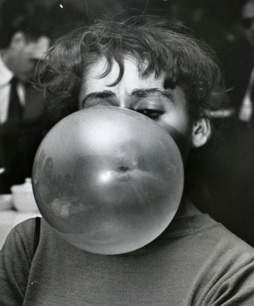 Weegee - Woman blowing a bubble, c. 1956. porn pictures