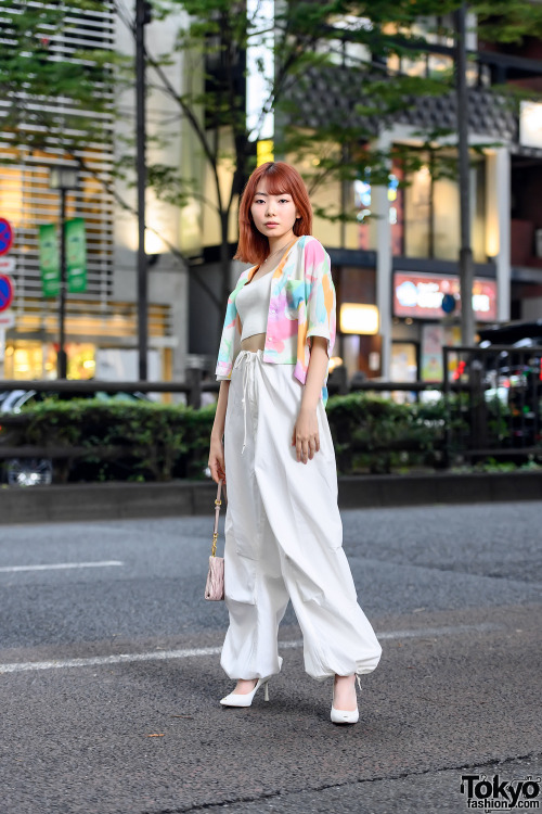 19-year-old Japanese model Uta on the street in Harajuku with an orange hairstyle, a cardigan over a