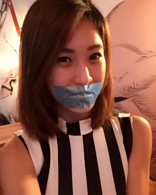 Asian girl fake tape gagged