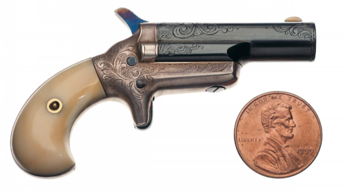 Engraved miniature Colt Third Model derringer with ivory grips.