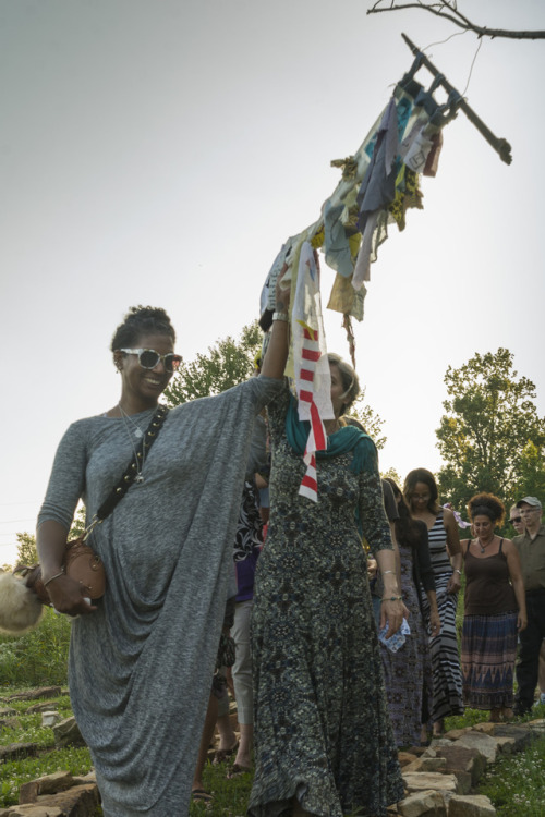Chelesea holding up the  Diversity Dream Scroll during the performance ritual. Photo credit Gregory Wendt