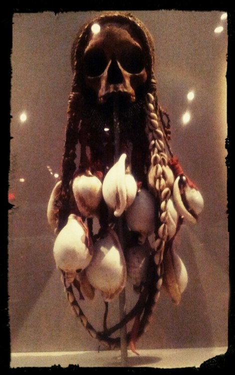 Skull Reliquary. Gulf of Papua. 19th Century. Human skull, string, shell, trade cloth, rattan. Objec