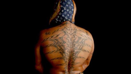 shitloadsofwrestling:  Rey Mysterio’s Tattoos From ReyMysterio.com:  Rey Mysterio is not only known for his awe-inspiring moves, but his exotic and meaningful tattoos. Mysterio, who has even claimed himself that he is addicted to ink, represents his
