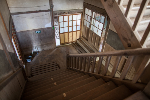 The empty halls of a long forgotten wooden schoolhouse in Japan.