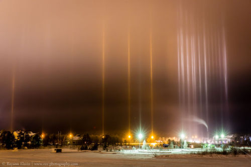 sixpenceee:  A light pillar is an atmospheric optical phenomenon, which is an interaction of light with ice crystals. When the temperature drops and these crystals position themselves horizontally as they fall through the air, they act as “vessels”