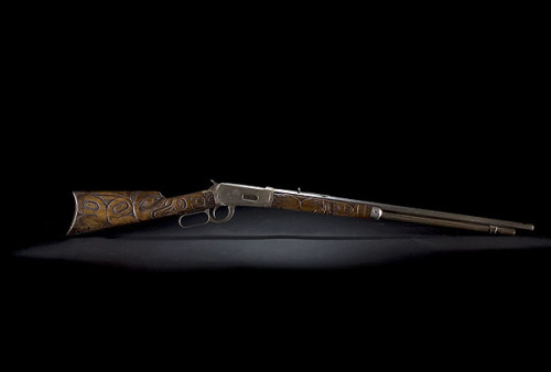 Winchester Model 1894 lever action rifle with carvings by the Tlingit people, Pacific Northwest, lat