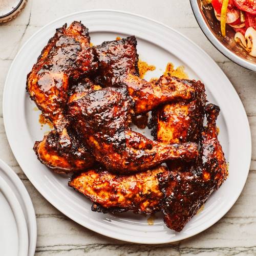 Grilled chicken with mustard barbecue sauce and tomato salad