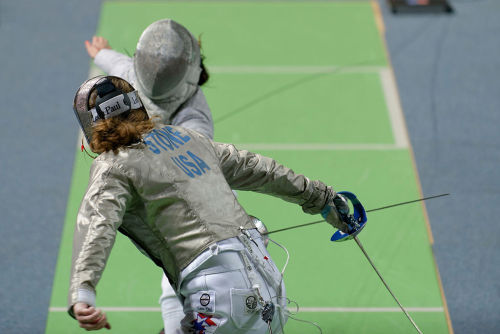 modernfencing: [ID: two sabre fencers in a bout. The fencer in the foreground is parrying prime.]Sar