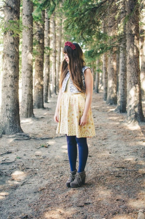 Opaque dark blue tights, grey boots, yellow flower print dress and jacket