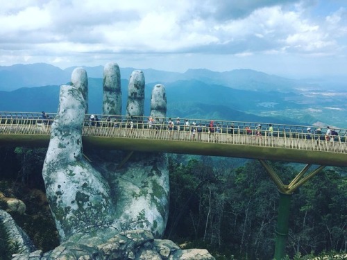 itscolossal:Vietnam’s Newly Opened Pedestrian Bridge Lifts Visitors with a Pair of Giant Weath