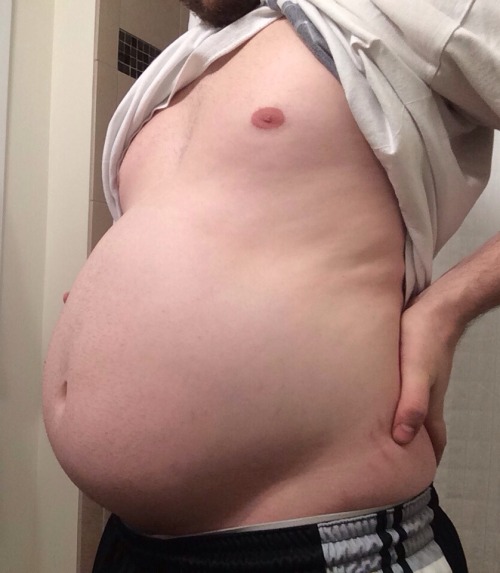 bellylover111:  So I obviously keep growing 😏  Im so stuffed and inflated… It hurts to move, I feel so huge and round! I decided to see how much i could eat tonight and then seeing and feeling the massive size of my giant gut decided ‘hey why not
