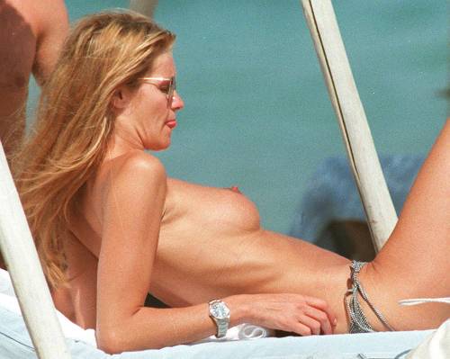toplessbeachcelebs:  Elle Macpherson (Model) sunbathing topless in St. Tropez (July 1995)