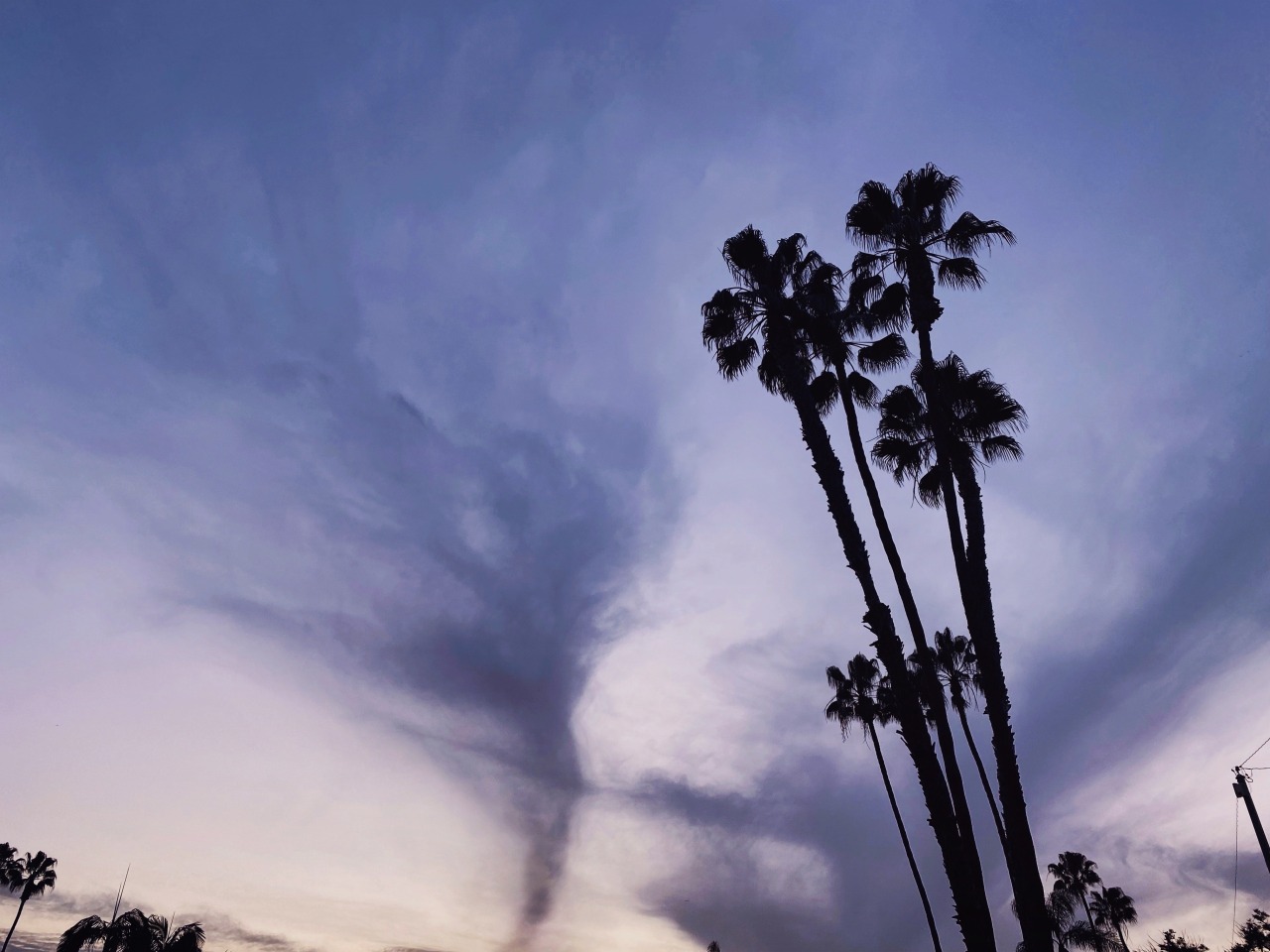 The cloud looked like a tornado. ∞ #upload#tornado#clouds#anaheim#palm trees#photography#sky#dusk