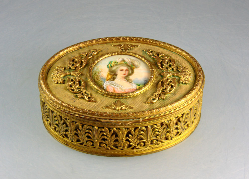 A gold box with a miniature portrait of Marie...