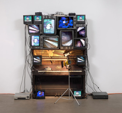 Nam June Paik
Untitled
1993
Player piano, 15 televisions, two cameras, two laser disc players, one electric light and light bulb, and wires
overall approx. 8′ 4″ x 8′ 9″ x 48″
Great article about the piece’s restoration over at the MoMA’s site.