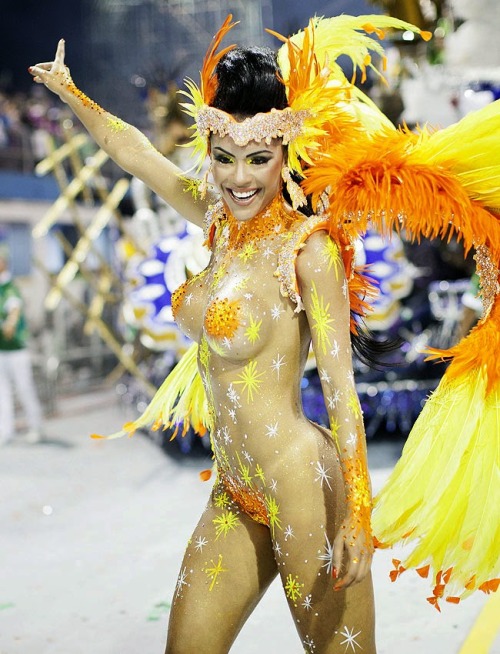 Porn photo Naked woman in body paint at a Brazilian carnival.