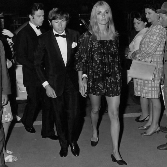 Sharon Tate and Roman Polanski attend a screening of 'Black Jesus' at the 1968 Cannes Film Festival. Her black chiffon dress 