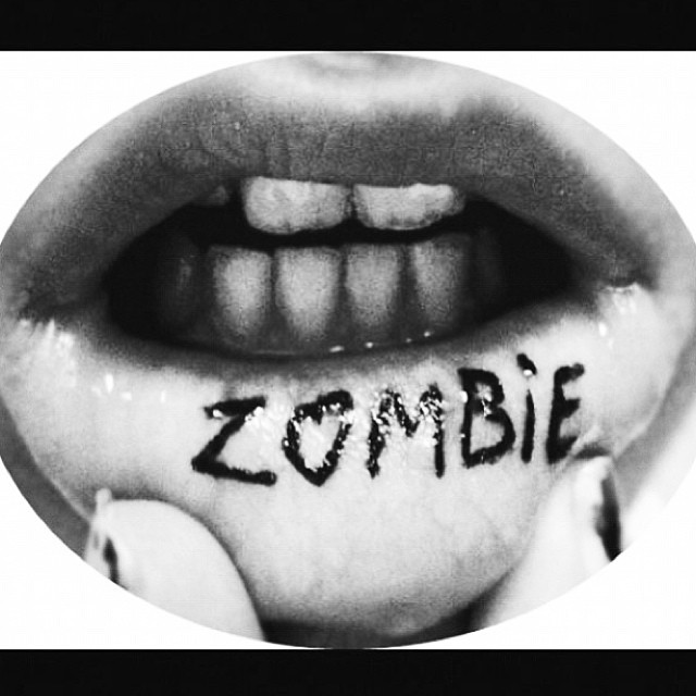 cherryface:  Sometimes I forget that I have this baby on my lip #zombie #tattoo #swollenlip