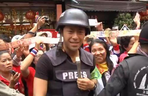 28-year-old handsome Japanese reporter, Daijiro Enami, from Fuji Television Network, steals spotlight from Thai politics Cr: AsiaOne