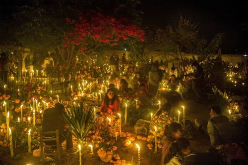 unrar:  People celebrate the Day of the Dead among graves at a cemetery, Mexico, Tino Soriano.